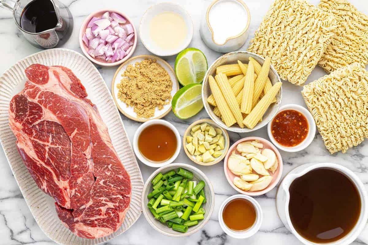 Bowls of ingredients to make shredded beef ramen.