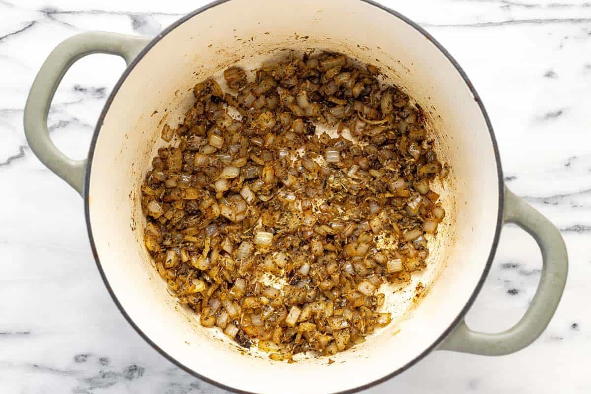 Sauteed veggies in a large soup pot.