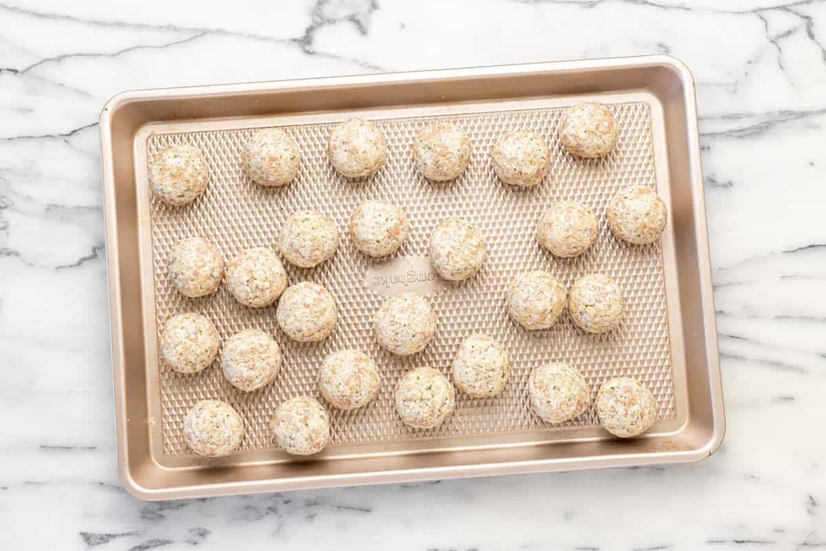 Chicken meatballs on a sheet pan.