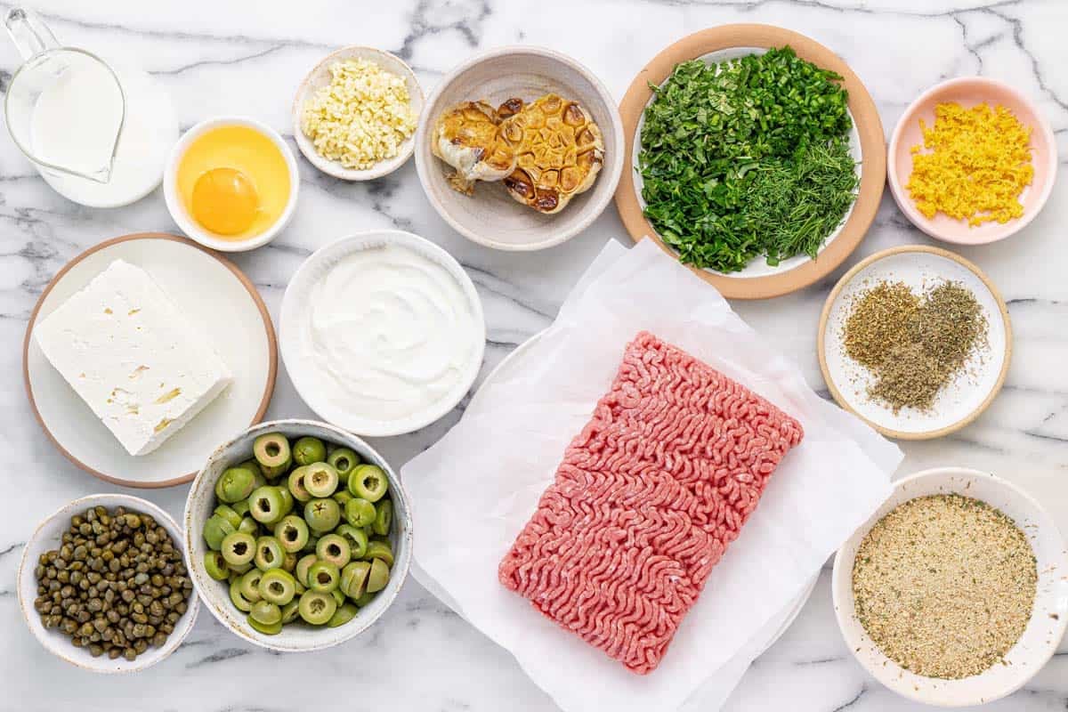 Bowls of ingredients to make herby meatballs with whipped feta.