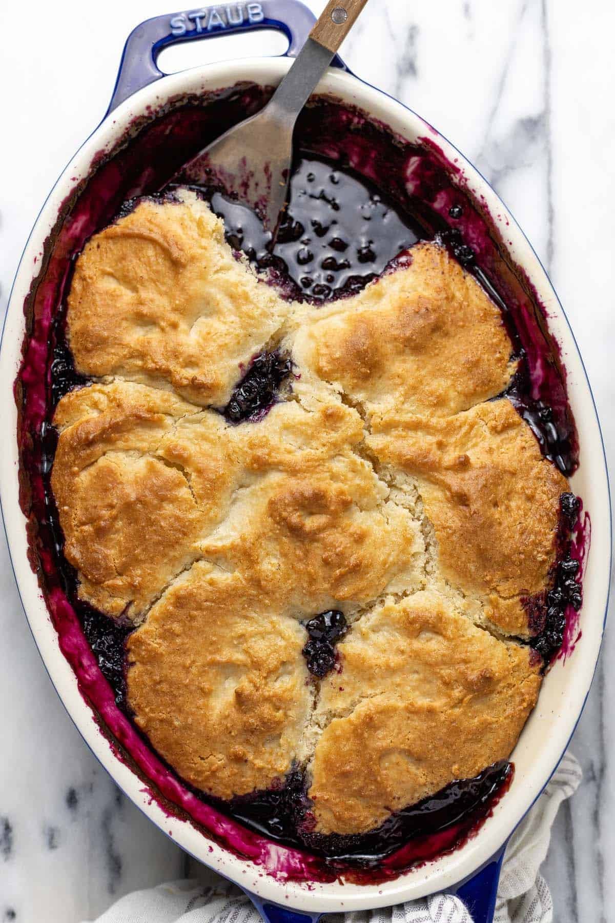 Large baking dish filled homemade blueberry cobbler.