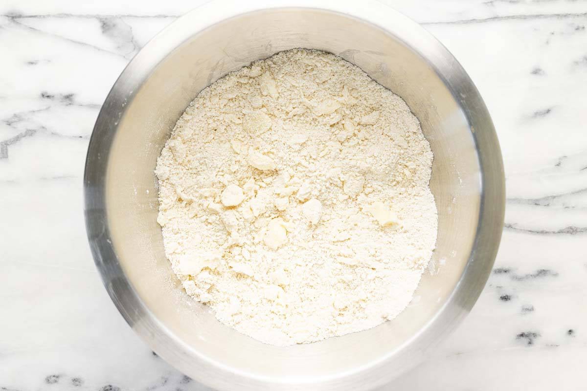Pea size bits of butter cut into the dry ingredients for cobbler.