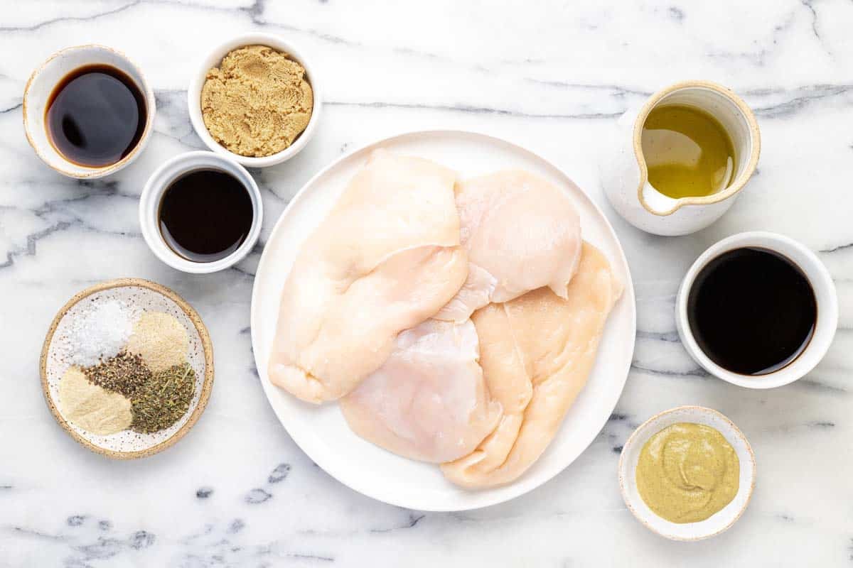 Bowls of ingredients to make a delicious chicken marinade.