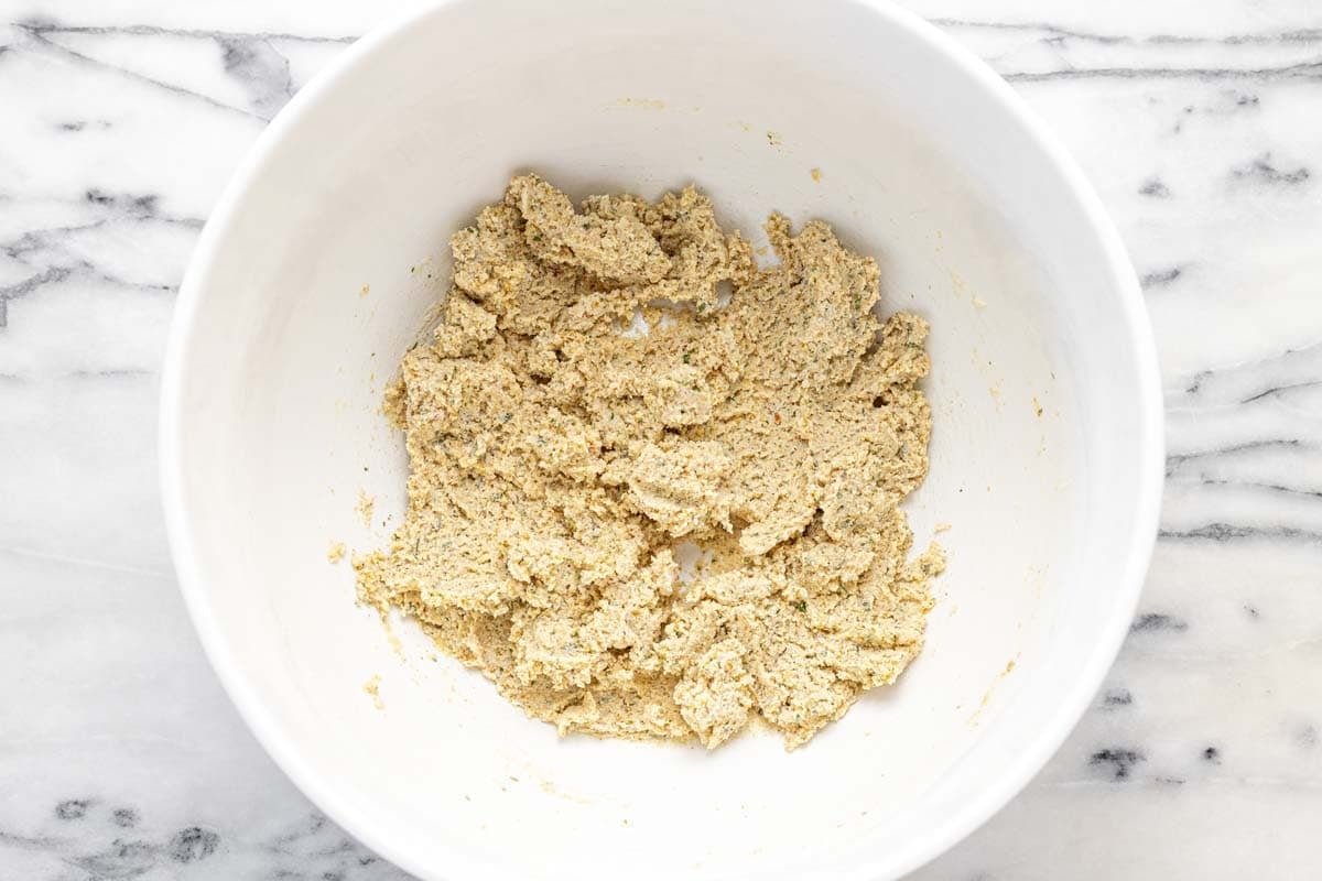 Panade (breadcrumbs, ricotta cheese, and milk) in a large mixing bowl.