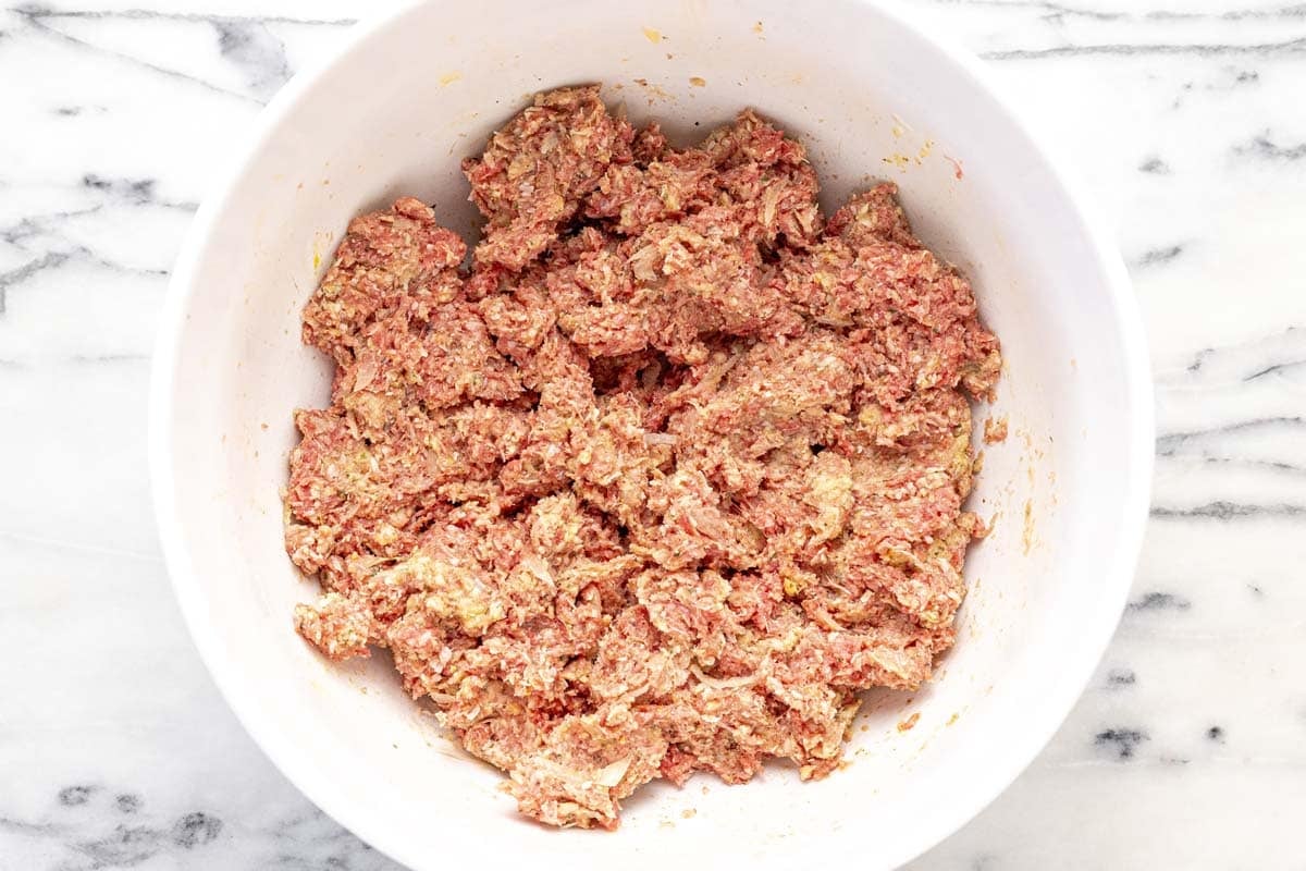 Meatball mixture in a large bowl.