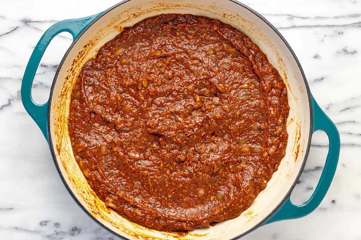 Aromatic base for the meatball sauce with veggies, herbs, and tomato paste.
