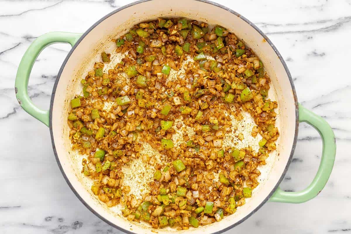 Sauteed veggies in a large pan.