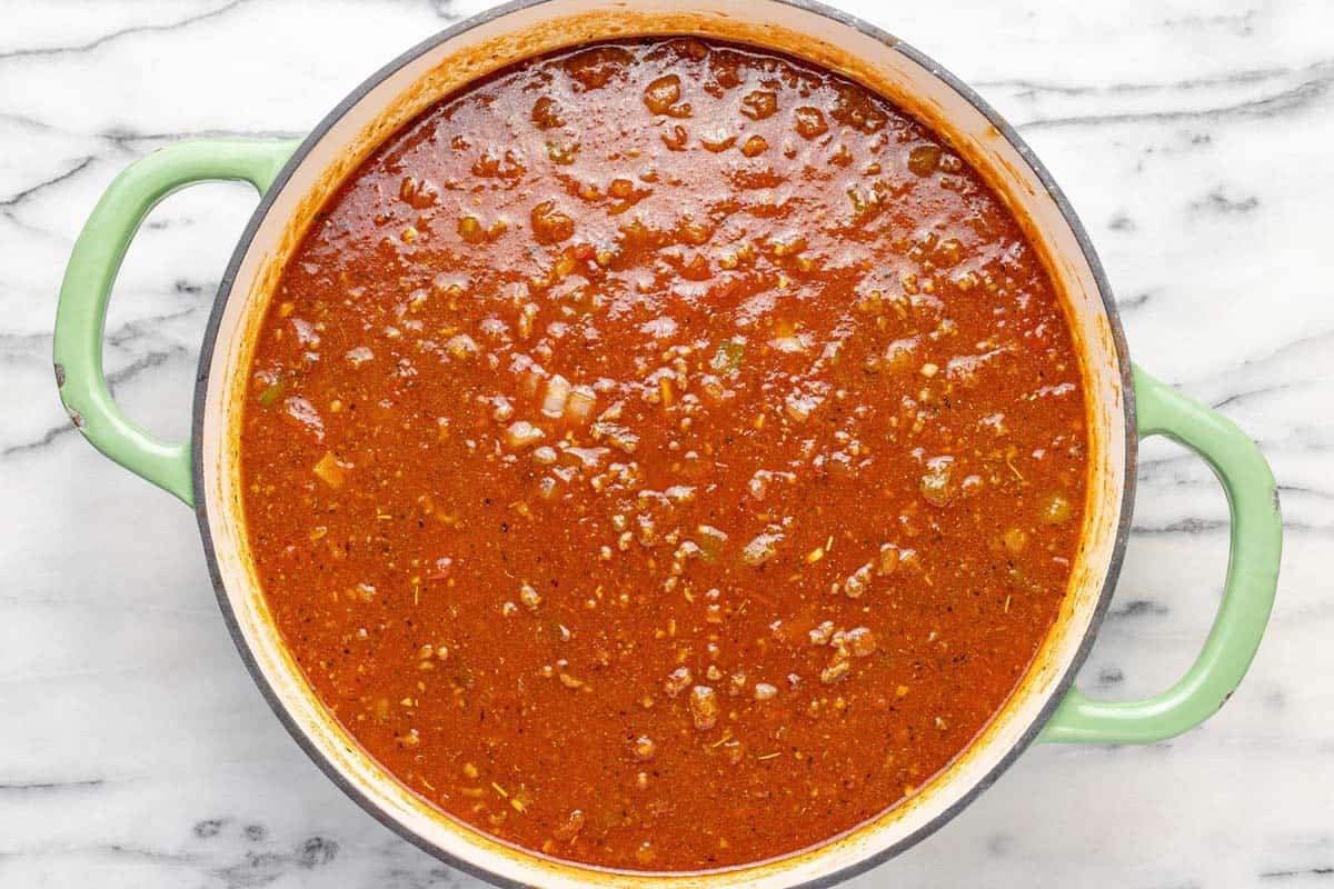 Large pan filled with sauce for a homemade goulash.