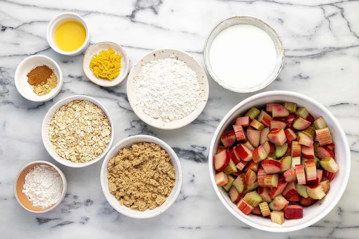 Bowls of ingredients to make homemade rhubarb crisp.