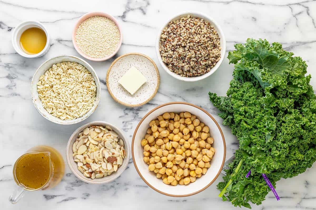 Bowls of ingredients to make sesame kale and quinoa salad.