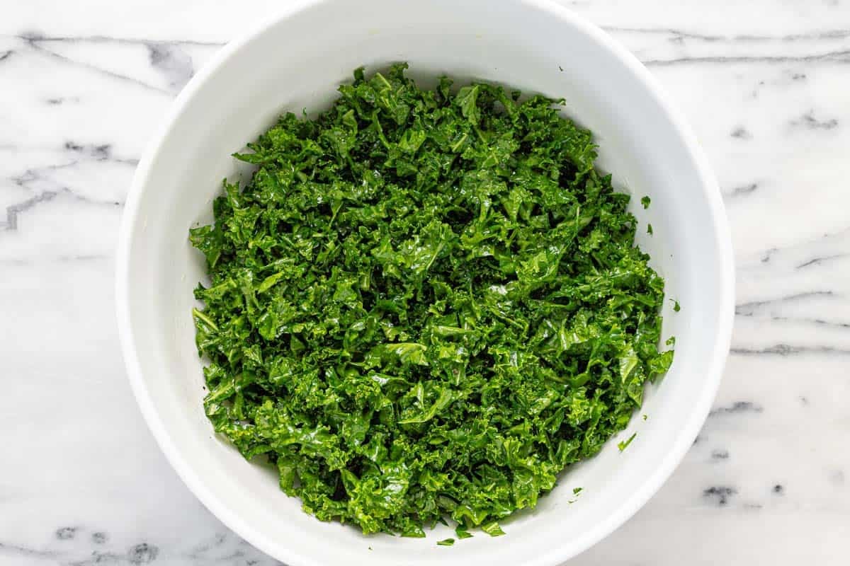 Massaged kale in a large bowl.