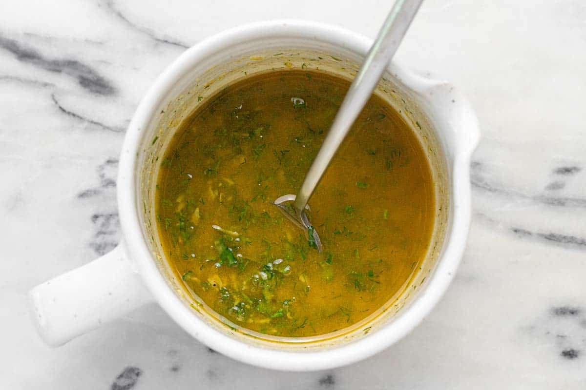 Bowl of dressing for white ben salad.