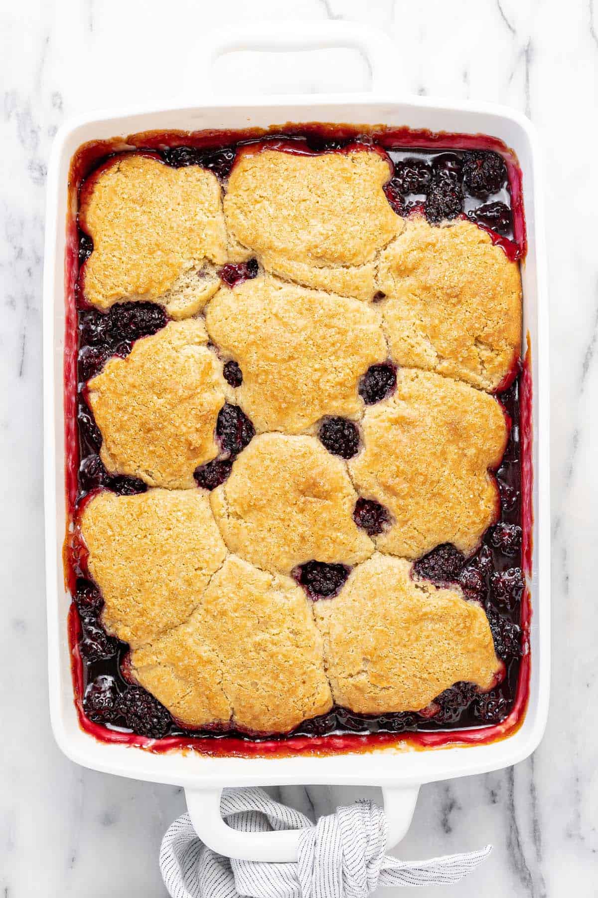 Freshly baked blackberry cobbler in a large baking dish.