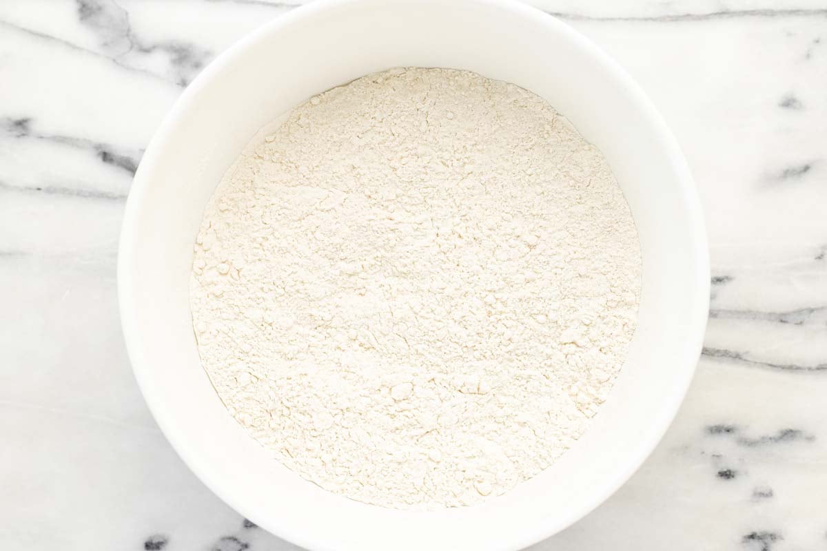Bowl filled with dry ingredients for the cobbler topping.