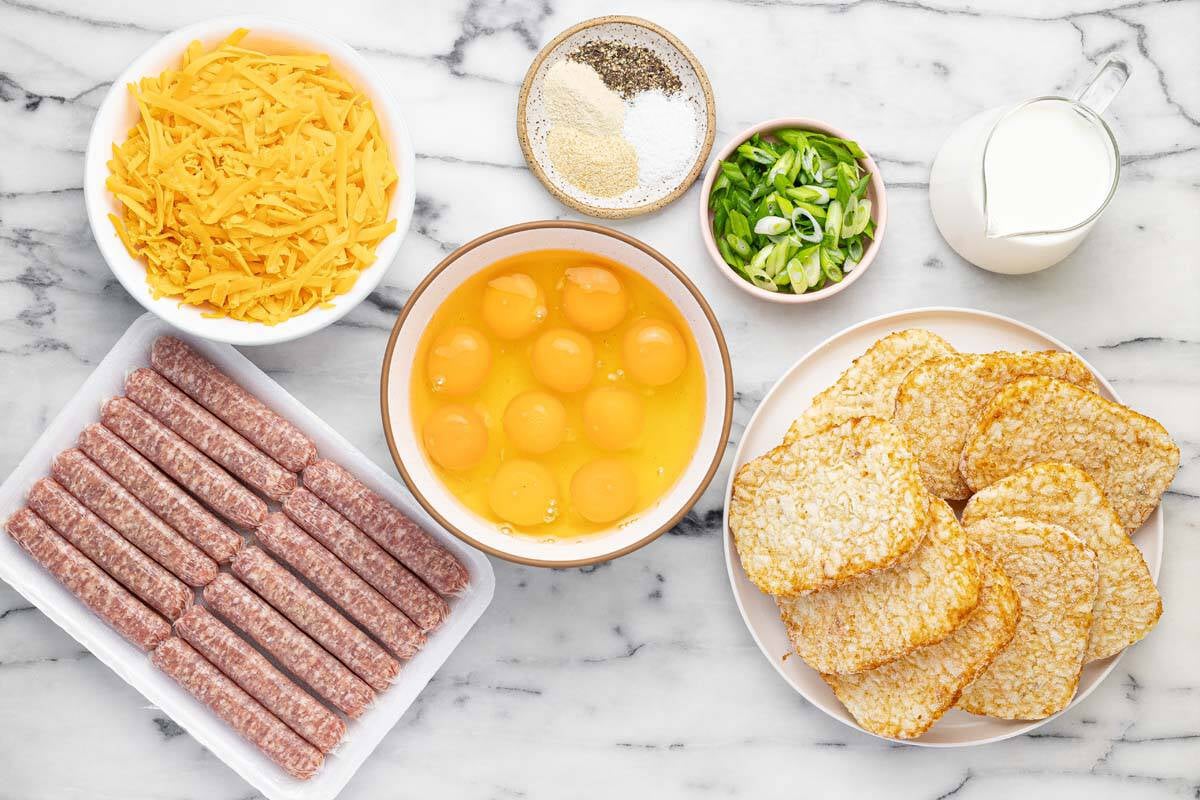 Bowls of ingredients to make a breakfast casserole recipe.