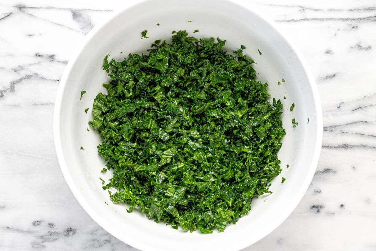 Large bowl filled with massaged kale.