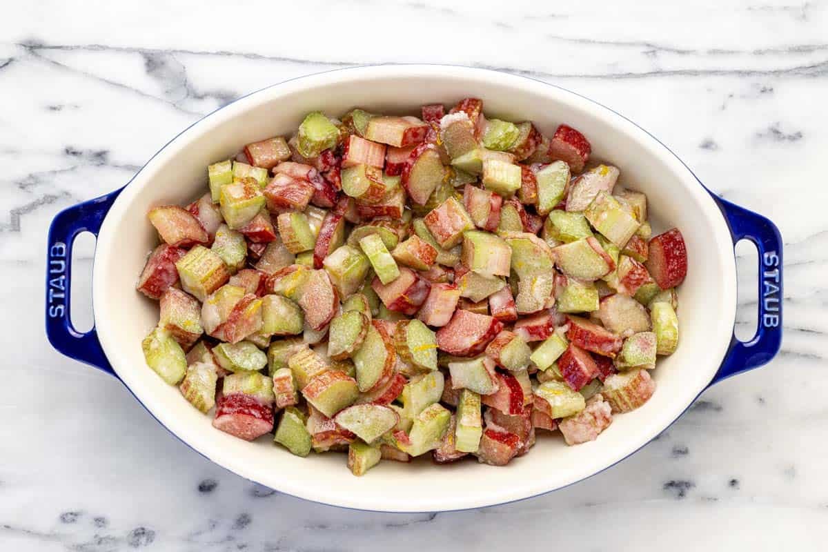 Rhubarb crisp filling in a large baking dish.