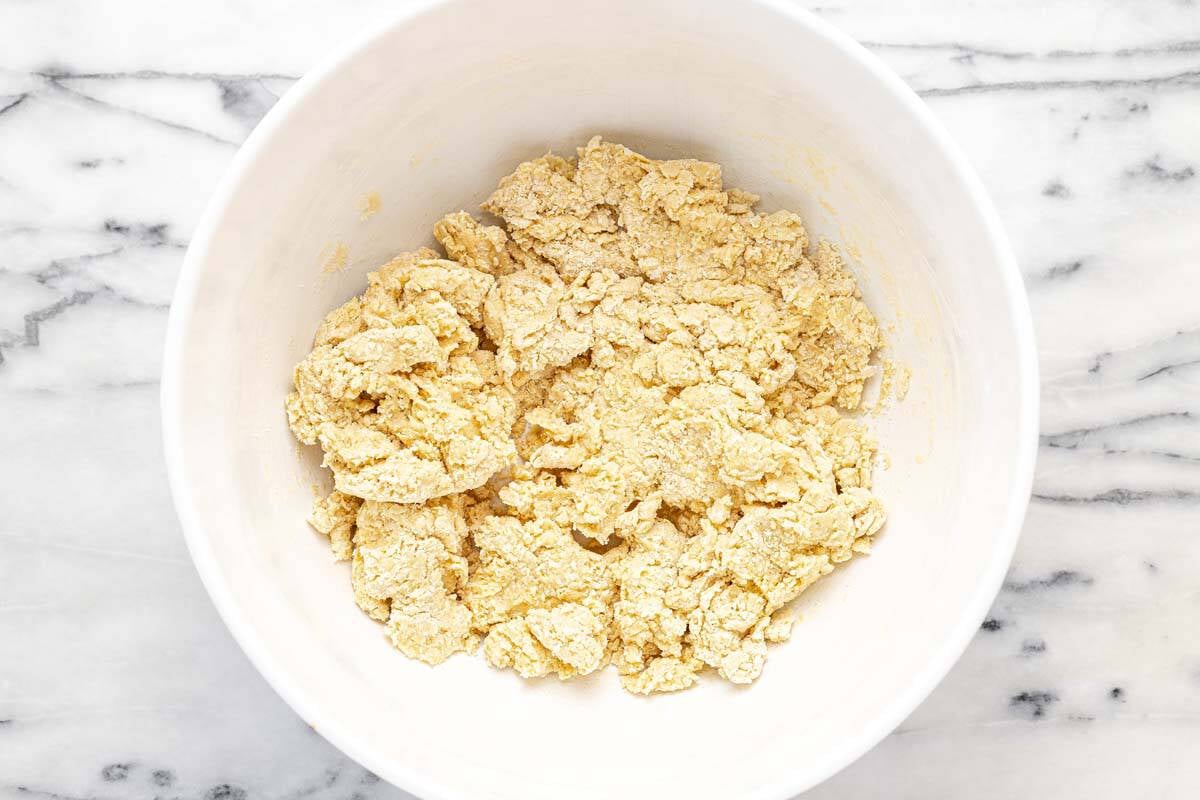 Shaggy dough in a bowl for the rhubarb dessert crust.