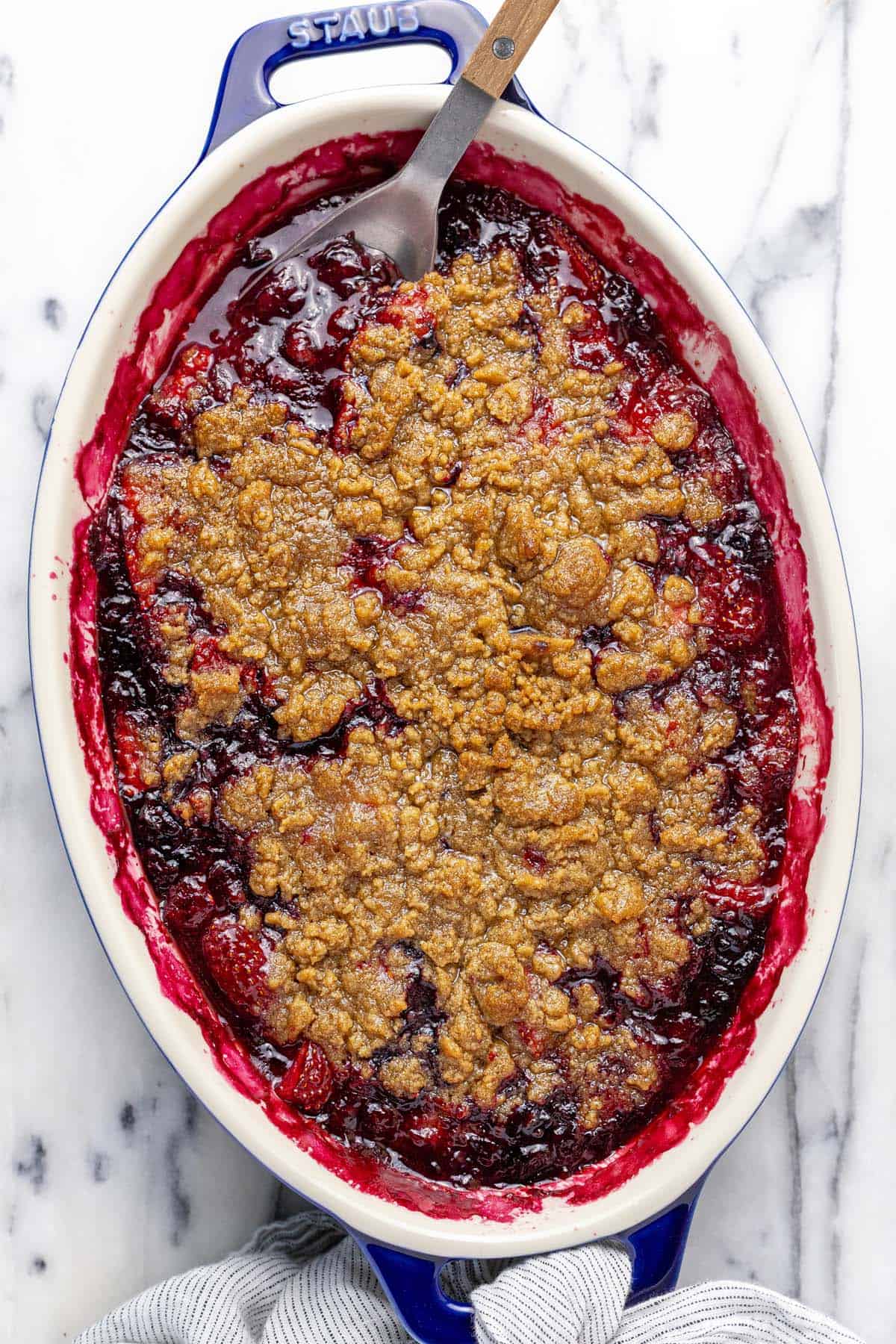 Baking dish filled with homemade berry crumble.