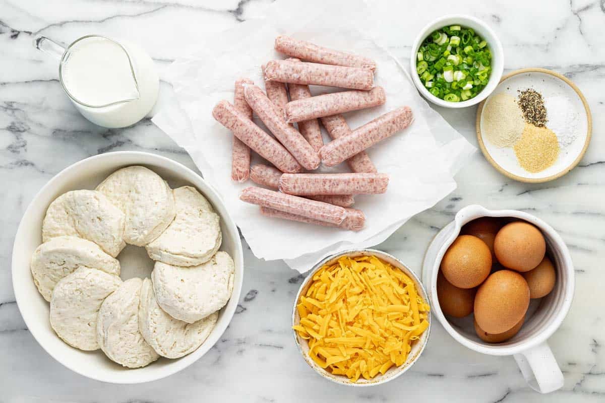 Bowls of ingredients to make a biscuit breakfast bake.