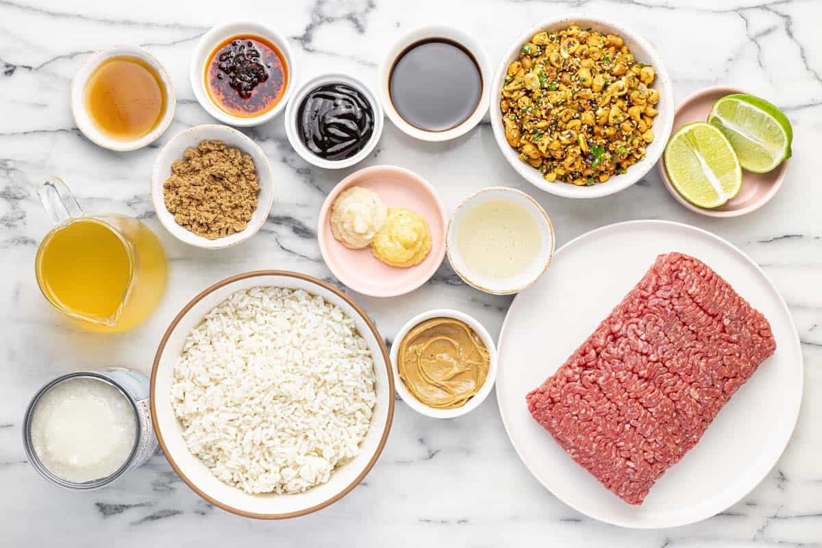 Bowls of ingredients to make brothy rice bowls with ground beef.