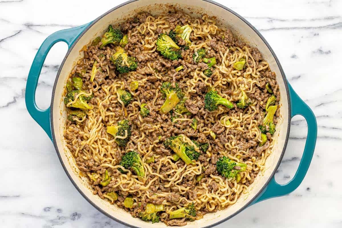 Large pan filled with sesame ginger ground beef and peanut noodles.