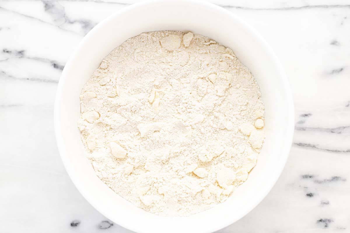 Dry ingredients with butter cut in to make cobbler topping.