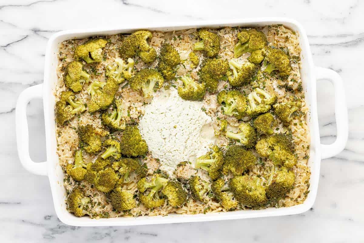 Baked chicken and orzo casserole in a large baking dish.