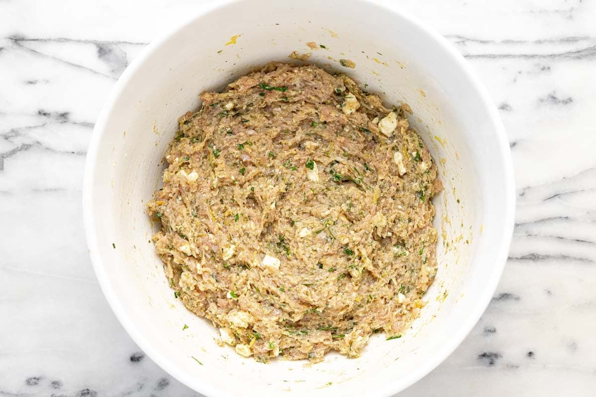 Meatball mixture in a large bowl.