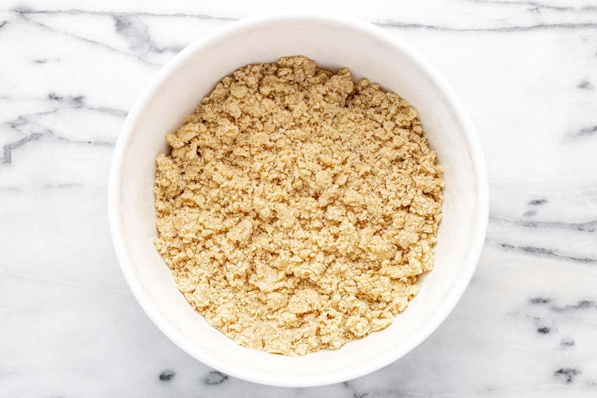 Crumble topping in a large bowl, ready for apple crumble.