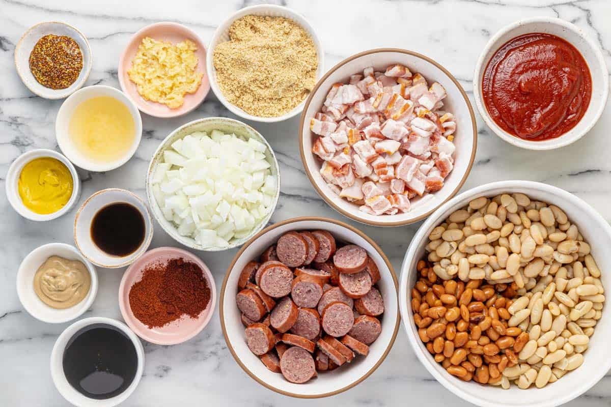 Bowls of ingredients to make homemade baked beans.