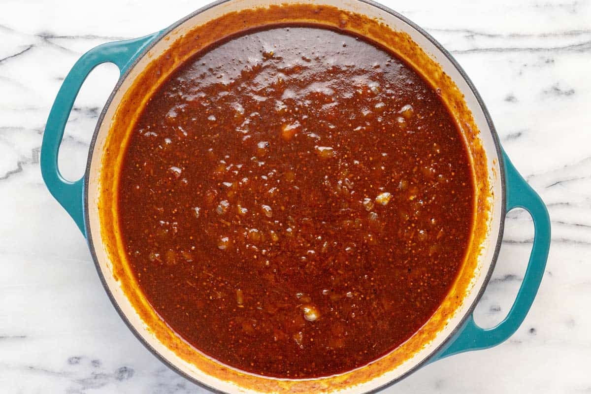 The sauce for baked beans in a large pan.