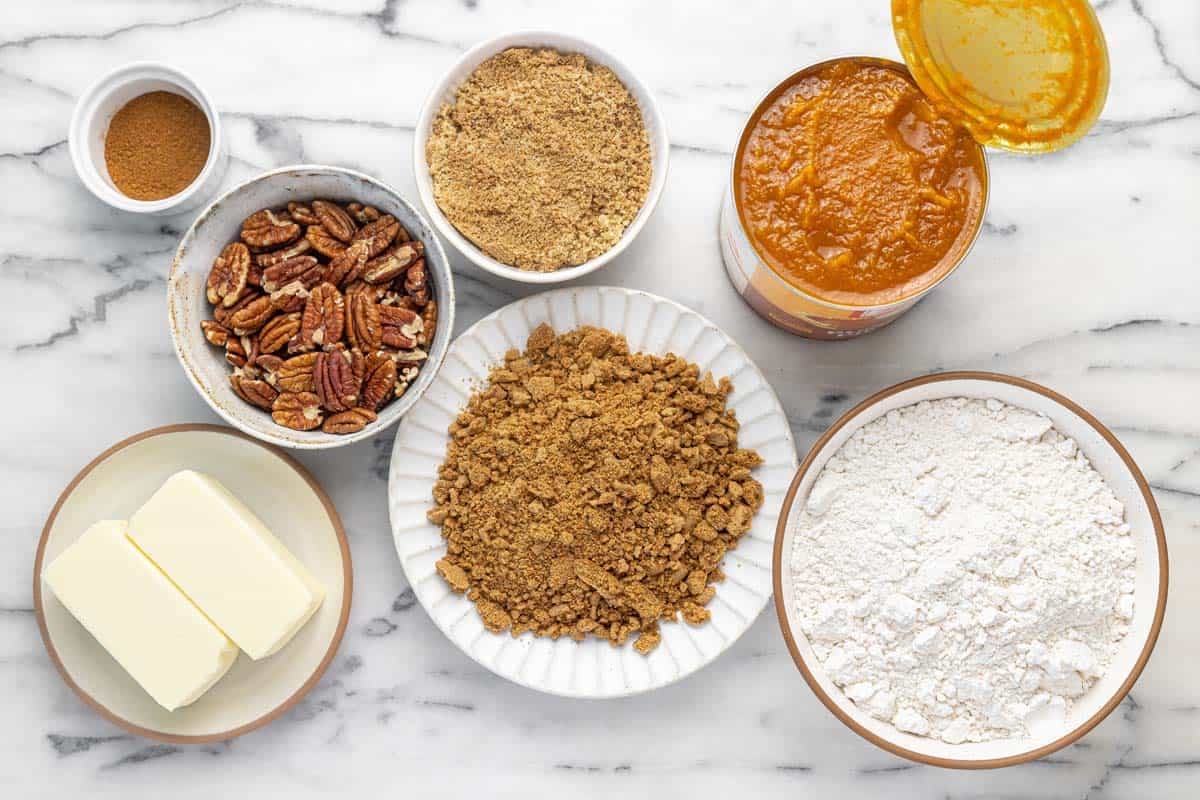Bowls of ingredients to make pumpkin dump cake.