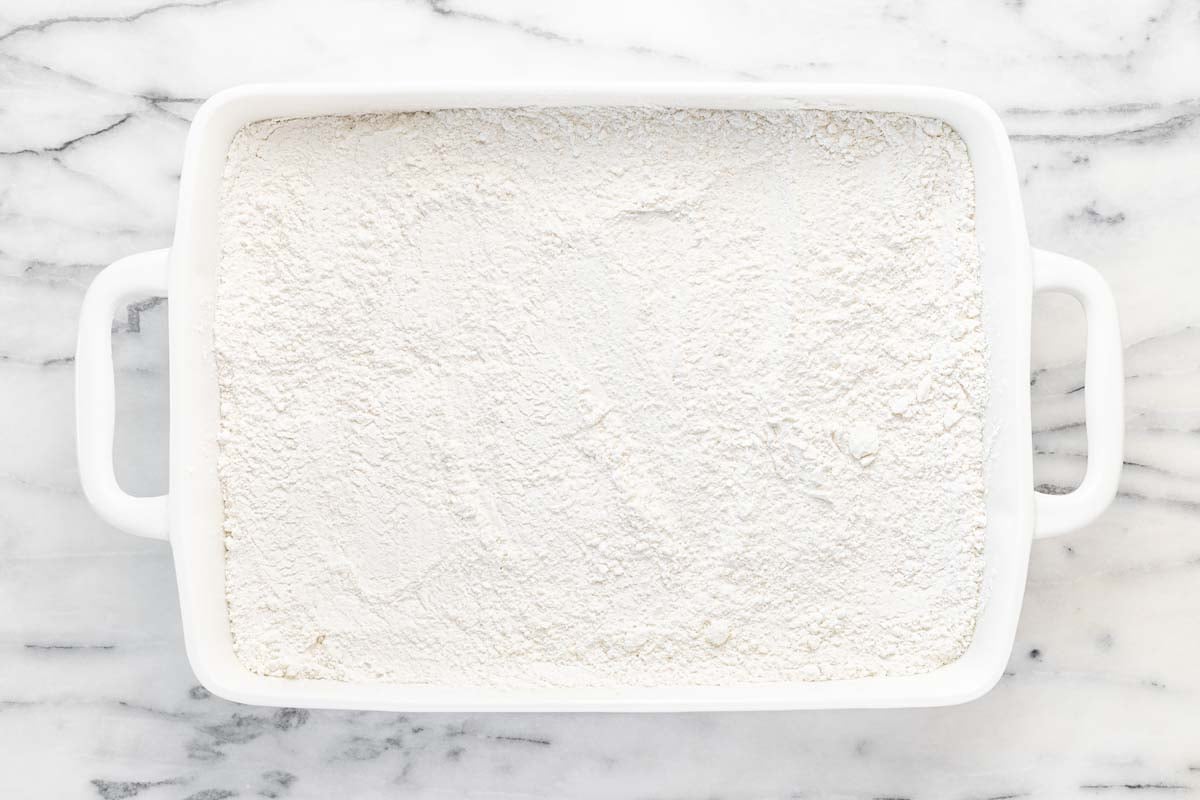 Cake mix sprinkled over pumpkin pie filling.